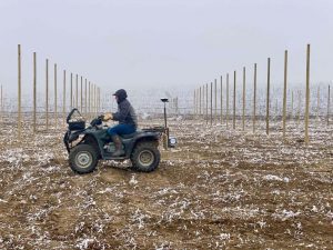Man on an ATV Quad surveys frost in a field with SoilOptix® device