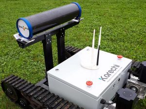 Autonomous robot with mounted sensor on grass